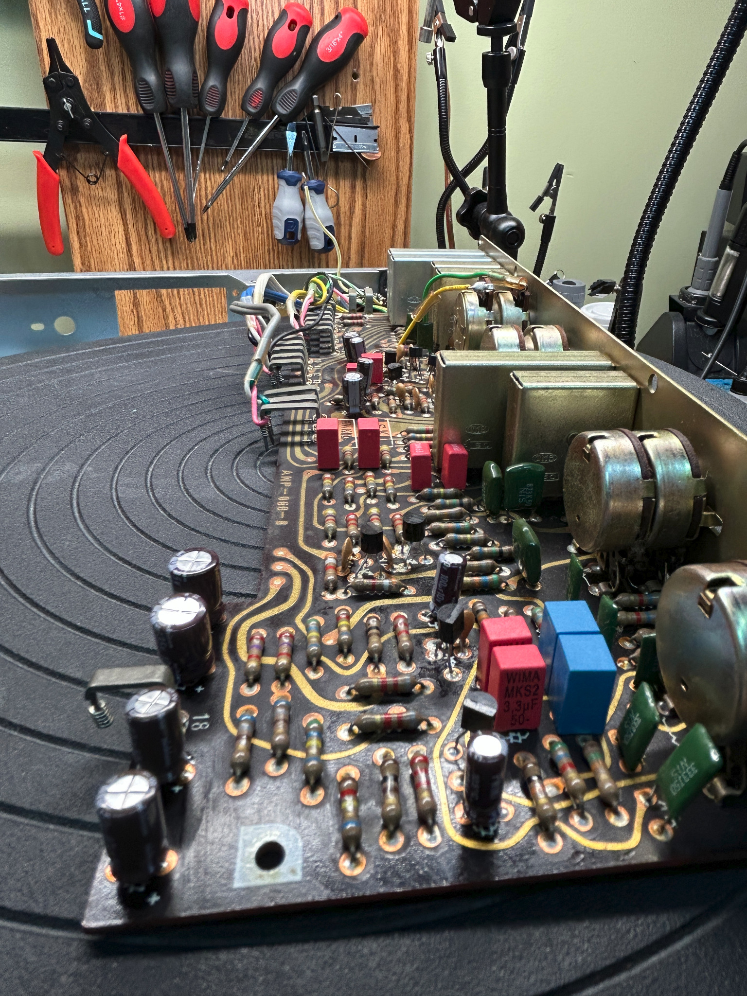 Detailed view of new film capacitors, electrolytics and transistors on the Pioneer SX-828 tone board